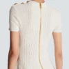 Ausgestelltes Kleid aus Krokodilstrick Ausgestelltes Kleid aus Krokodilstrick