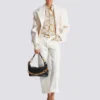 Bedrucktes Seidenhemd mit Balmain-Kettenmuster Bedrucktes Seidenhemd mit Balmain-Kettenmuster