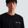Besticktes T-Shirt mit Balmain-Signatur Besticktes T-Shirt mit Balmain-Signatur