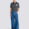 Gestreiftes Polohemd mit College-Emblem Gestreiftes Polohemd mit College-Emblem