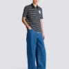 Gestreiftes Polohemd mit College-Emblem Gestreiftes Polohemd mit College-Emblem