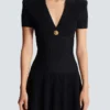 Kurzes ausgestelltes Strickkleid Kurzes ausgestelltes Strickkleid