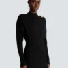 Kurzes ausgestelltes Strickkleid Kurzes ausgestelltes Strickkleid