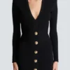 Kurzes, eng anliegendes Kleid aus geripptem Strick Kurzes, eng anliegendes Kleid aus geripptem Strick