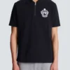 Kurzärmeliges Polohemd mit College-Emblem Kurzärmeliges Polohemd mit College-Emblem