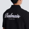 Kurzärmeliges Polohemd mit College-Emblem Kurzärmeliges Polohemd mit College-Emblem