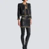 Lammfelljacke mit Kettenbesatz Lammfelljacke mit Kettenbesatz