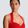 Midi-Kleid aus plissiertem Strick mit Neckholder Midi-Kleid aus plissiertem Strick mit Neckholder