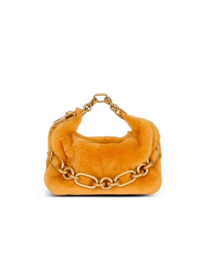 Mini Sync Tasche aus Lammfell Mini Sync Tasche aus Lammfell