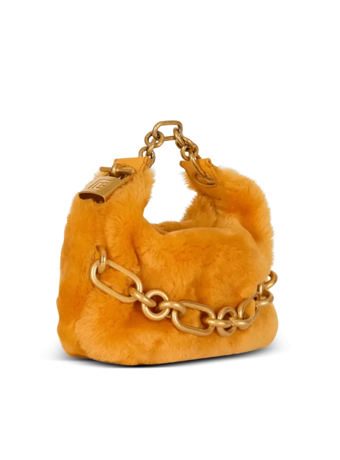 Mini Sync Tasche aus Lammfell Mini Sync Tasche aus Lammfell