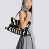 Mittlere Anthem-Tasche aus Leder und Ponyfell mit Zebradruck Mittlere Anthem-Tasche aus Leder und Ponyfell mit Zebradruck