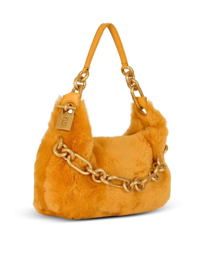 Mittlere Sync-Tasche aus Lammfell Mittlere Sync-Tasche aus Lammfell