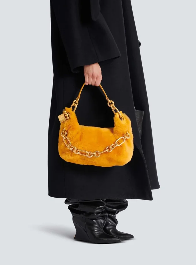 Mittlere Sync-Tasche aus Lammfell Mittlere Sync-Tasche aus Lammfell