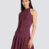 Ärmelloses, ausgestelltes Kleid aus durchbrochenem Strick Ärmelloses, ausgestelltes Kleid aus durchbrochenem Strick