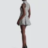 Ärmelloses, ausgestelltes Tweedkleid Ärmelloses, ausgestelltes Tweedkleid