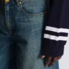 Weite Jeanshose aus verblasstem Denim Weite Jeanshose aus verblasstem Denim